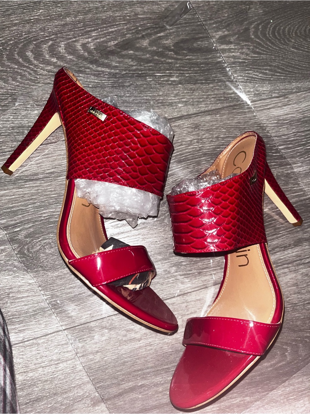 Calvin Klein Red Snake-Embossed Heel Slides defected inside the edge